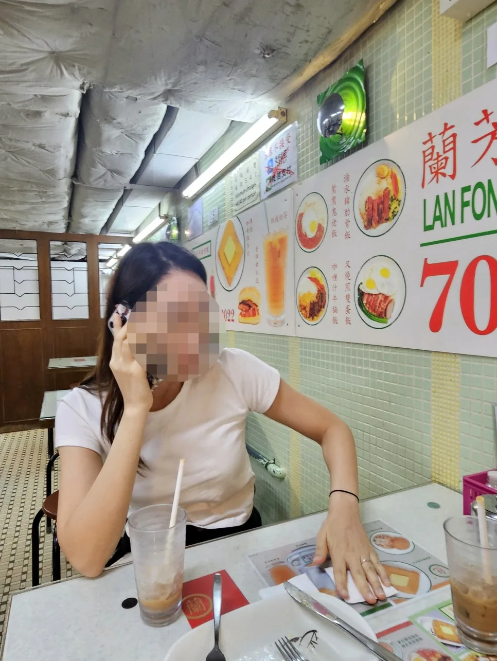 On the phone at Lan Fong Yuen